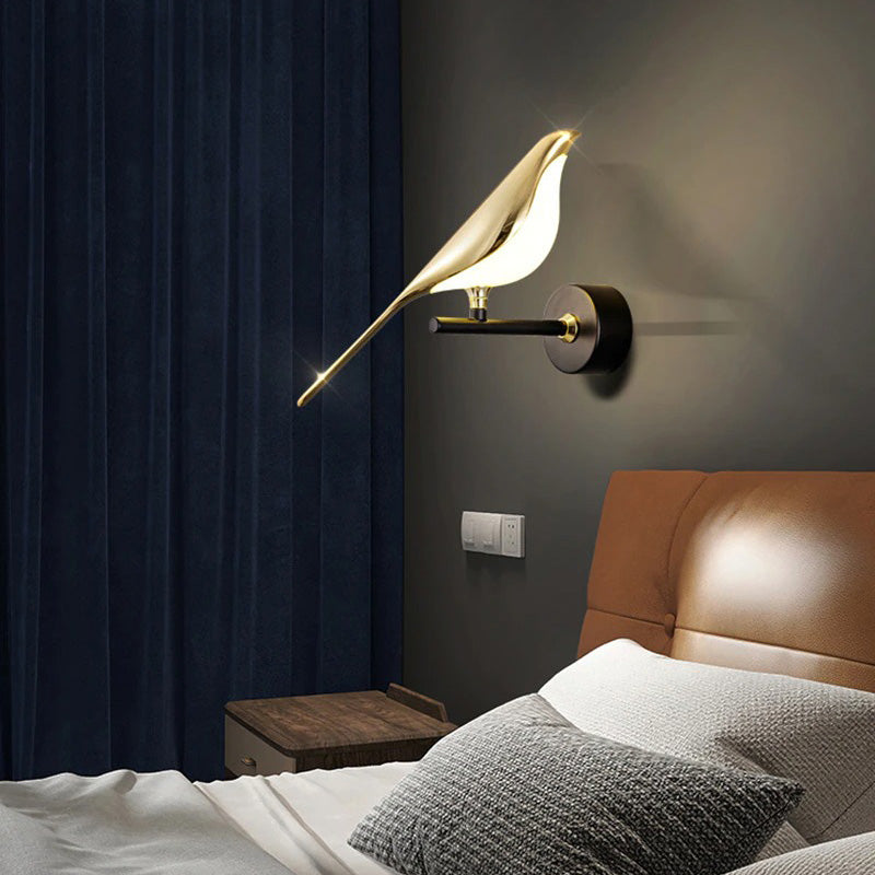 Soft, golden bird wall light adds a warm, inviting glow above the bed.