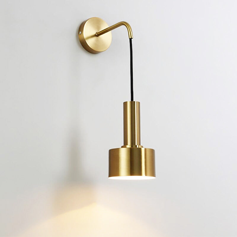 Experience elegant, focused lighting with ORLUNE HOME’s gold wall lamp and black cord.