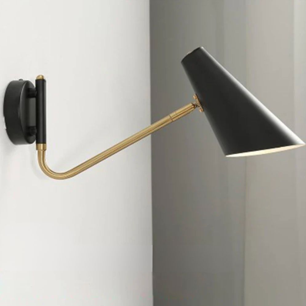 Experience stylish, focused LED illumination with a black shade and gold adjustable arm.