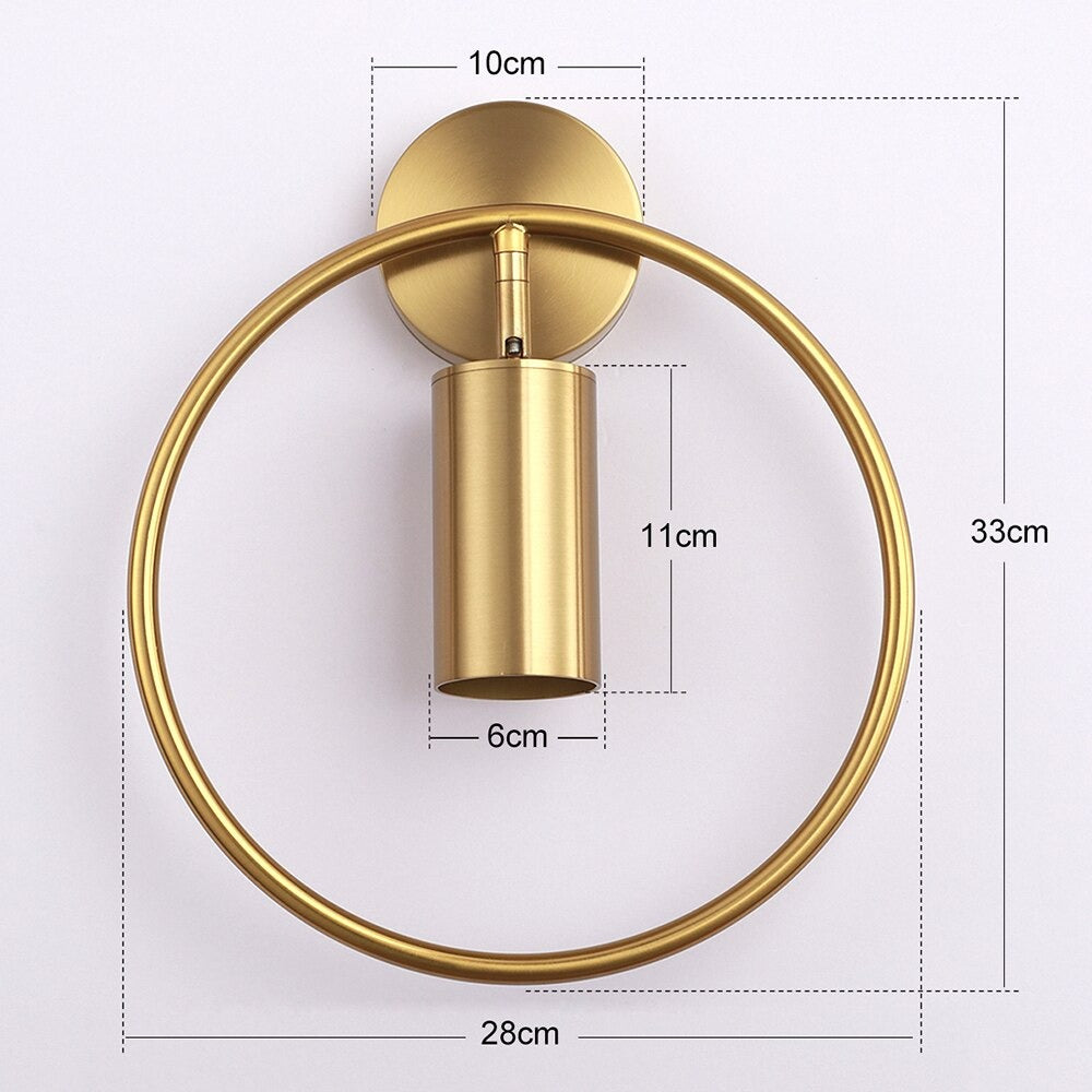 Circular gold LED light emits a warm, adjustable glow—modern lighting for staircases.