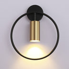 Soft gold LED glow radiates gently from the black-framed circular wall light.