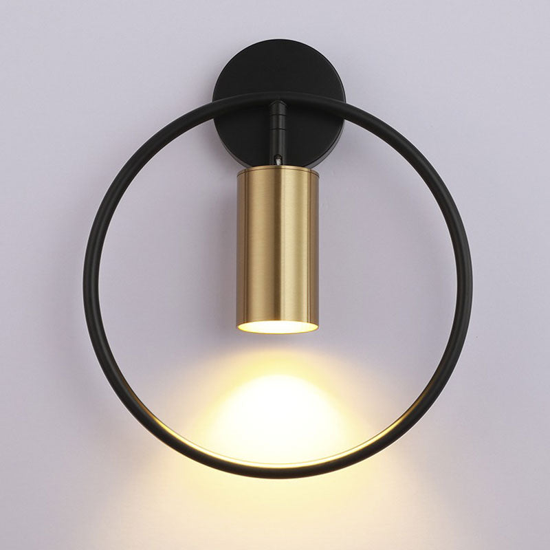 Modern circular LED wall light casts elegant, warm illumination downward for your staircase.