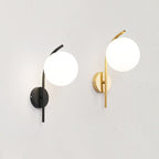 Modern LED moon lights with frosted globes emit soft, ambient kitchen illumination.