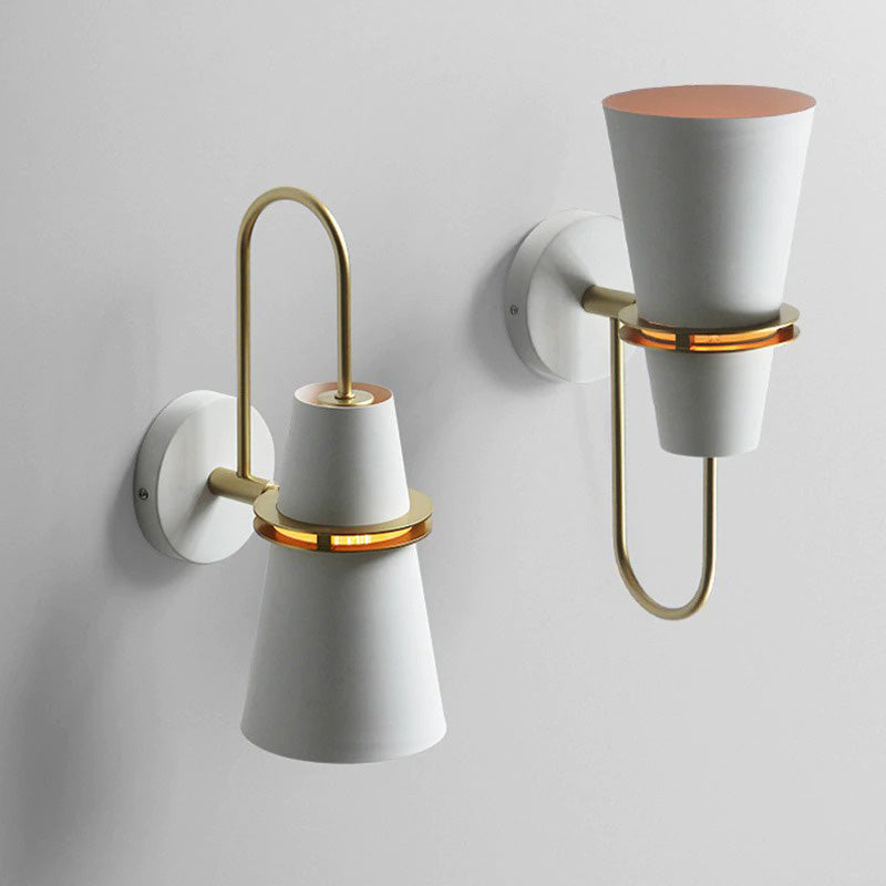 Soft, warm glow radiates from chic cone-shaped LED wall lights with gold accents.