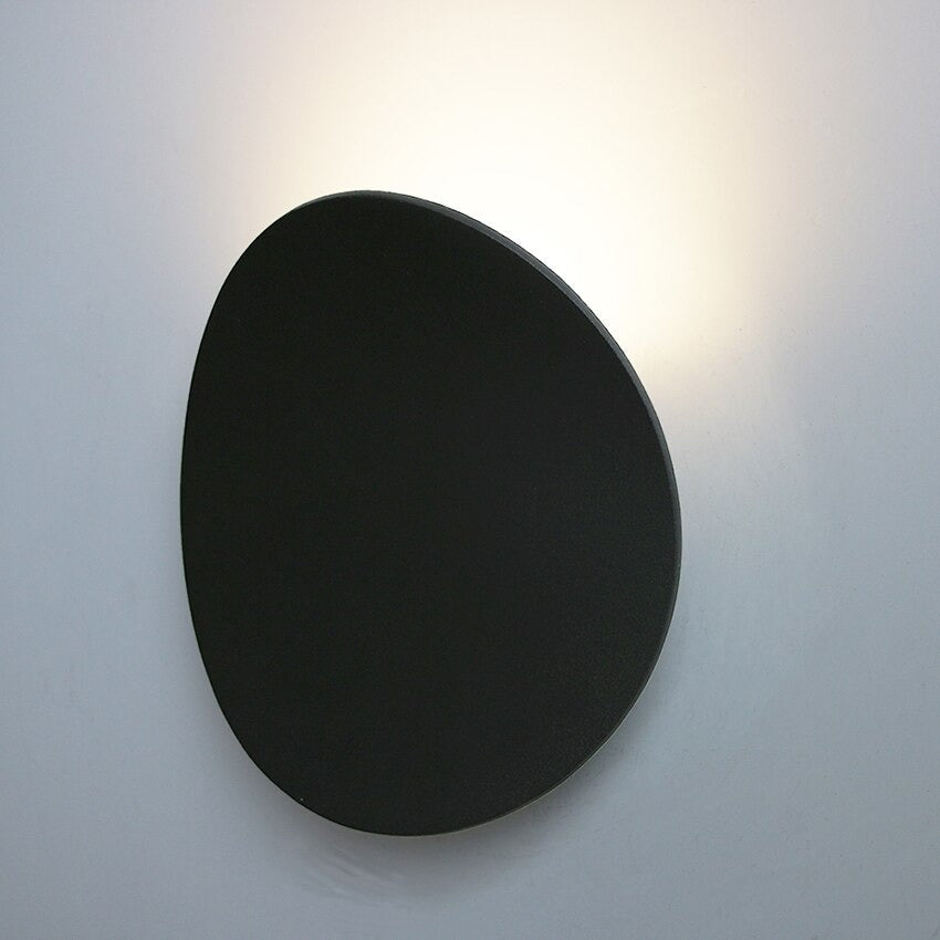 A soft white LED glow radiates gently, illuminating the blank wall with subtle ambience.