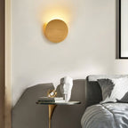 ORLUNE HOME Circular LED Wall Light glows warmly, creating a cozy and inviting atmosphere.