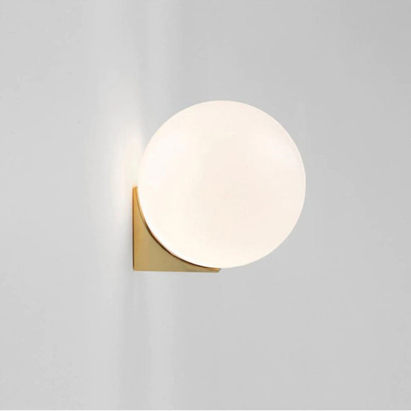 Minimalist frosted globe wall light creates soft, stylish modern illumination for your kitchen.