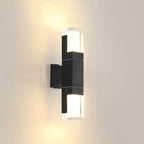 Warm LED light glows from both ends of this modern black wall-mounted fixture.