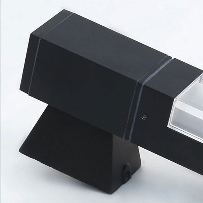 Modern black LED wall light offers efficient, motion-activated illumination with sleek design.