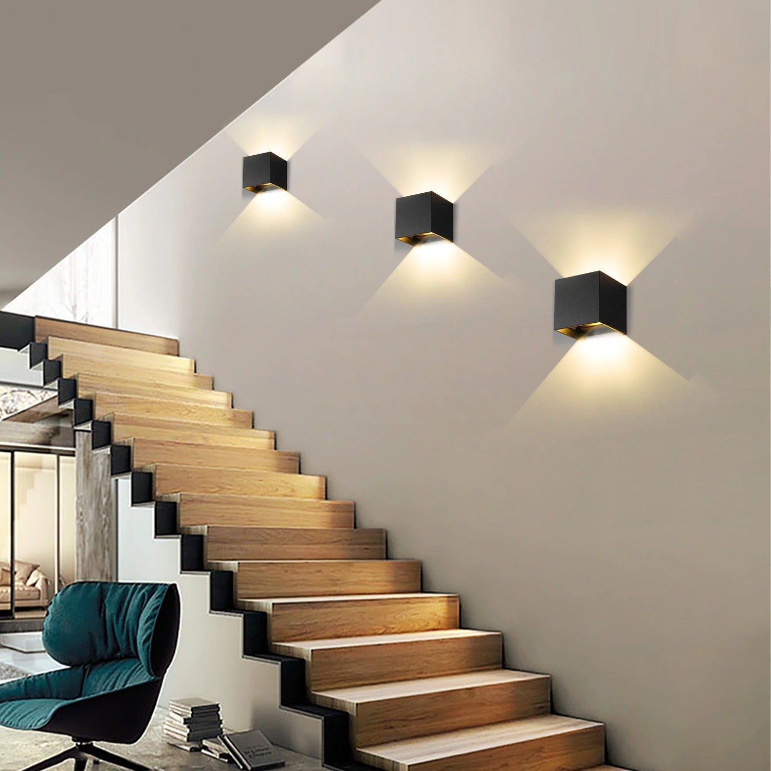 Three cube-shaped LED wall lights cast striking geometric patterns on the illuminated wall.