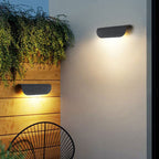 ORLUNE HOME’s wave design LED wall light casts bright, stylish illumination at dusk.