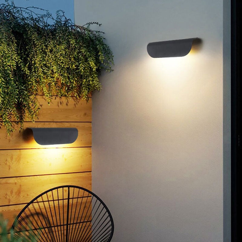 ORLUNE HOME’s wave design LED wall light casts bright, stylish illumination at dusk.