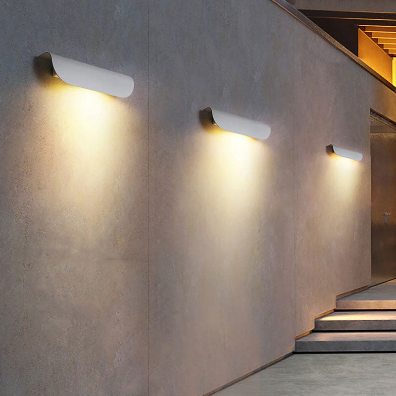 Warm LED stair lights with wave design create soft, even illumination in the corridor.