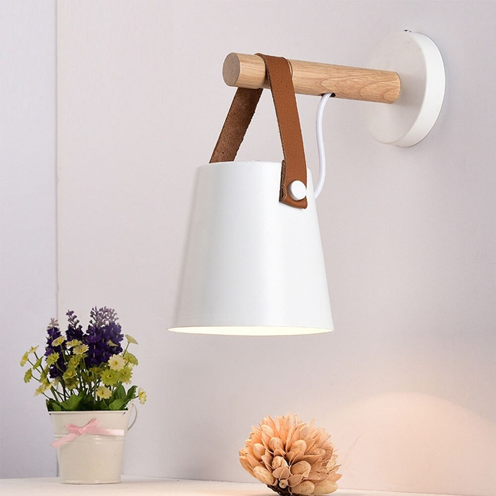 The Nordic Kitchen Wall Light casts soft, stylish illumination from its wood and leather design.