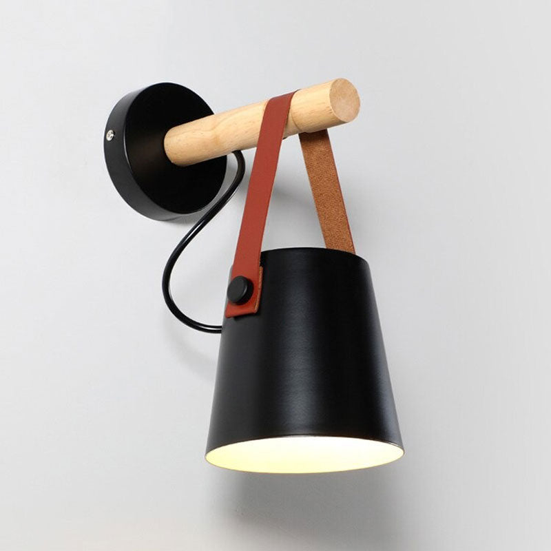 Elevate your lighting: black metal shade accented by wood and brown leather details.