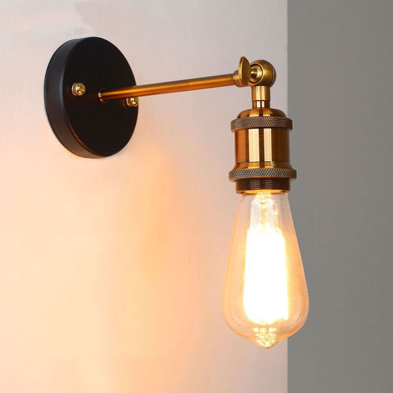 This sconce offers soft, focused illumination with an exposed bulb and adjustable arm.