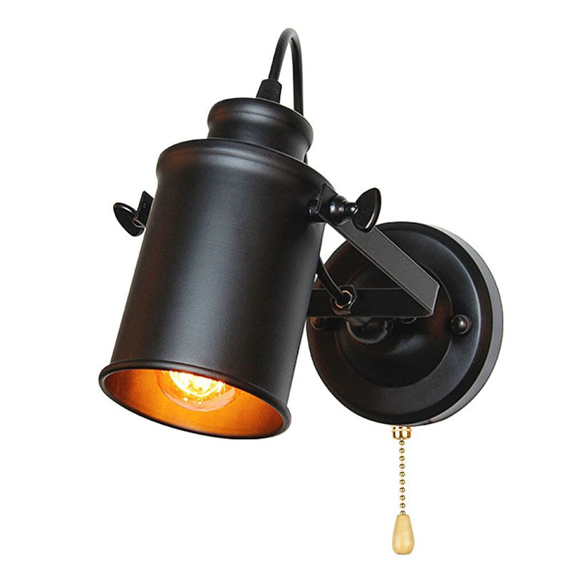 Industrial lamp's exposed bulb and black shade cast focused, customizable lighting in any space.