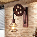 The industrial wall light offers exposed bulb brilliance and retro pulley design for ambient lighting.
