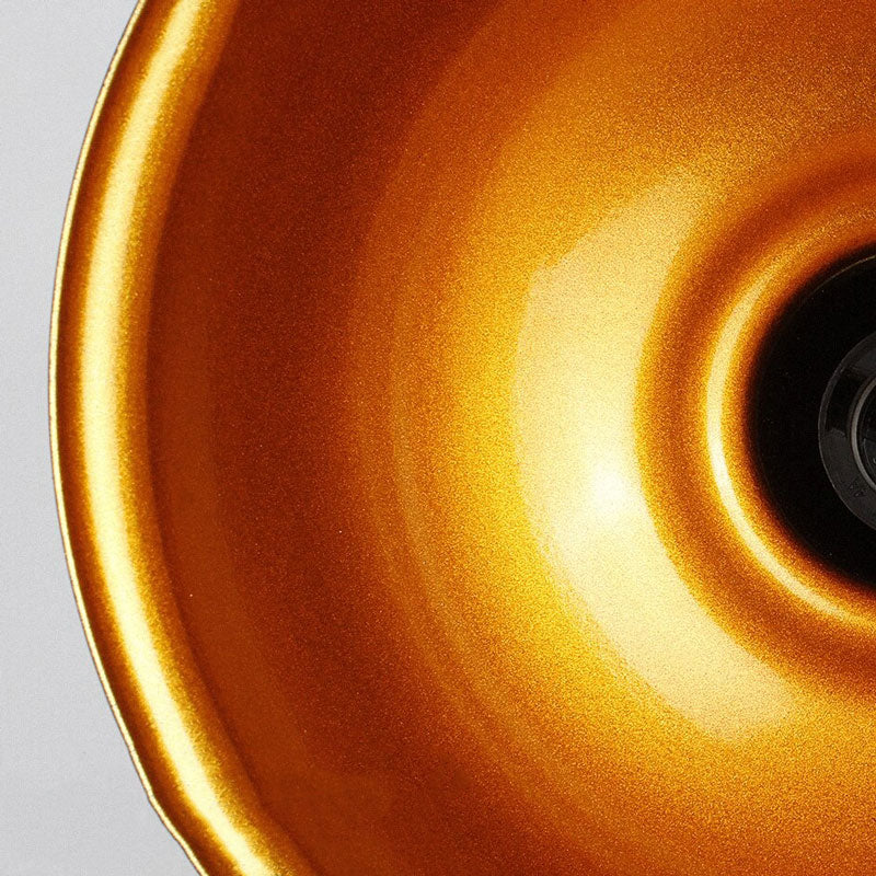 Sleek, reflective wall sconce casts focused light, perfect for creating ambient illumination.