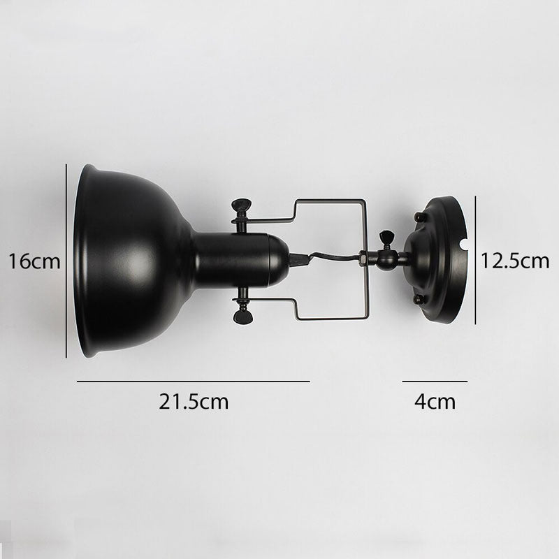 The sconce’s mushroom shade directs adjustable, focused lighting precisely where you need it.