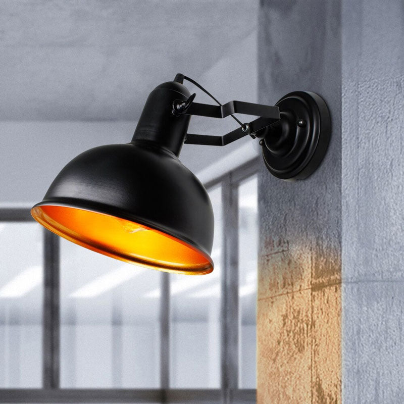This wall sconce creates a warm yellow-orange ambiance with its adjustable mushroom shade.