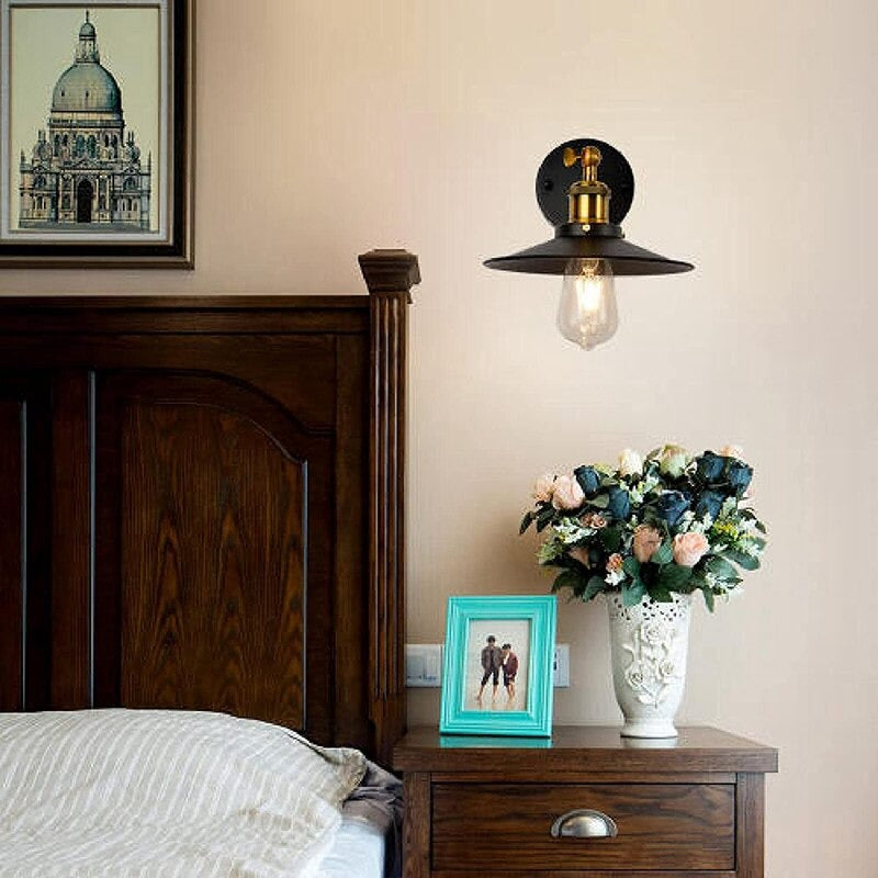 ORLUNE HOME wall light with cone-shaped metal shade casts a warm, focused glow.