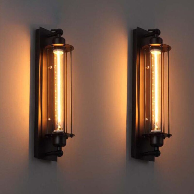 Vintage Edison bulbs glow through a black metal cage, showcasing bold, retro industrial lighting.