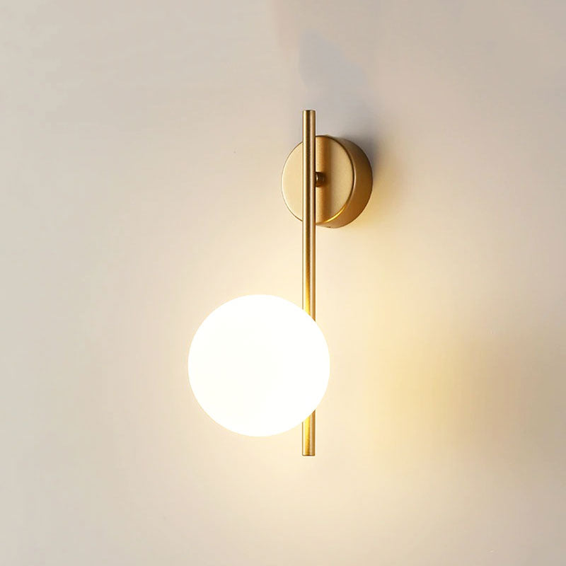 Soft, elegant LED light glows from a gold-mounted frosted glass globe on your wall.
