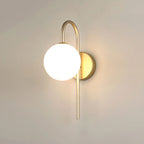 This moon-shaped LED wall light glows softly, adding elegant golden illumination to any space.