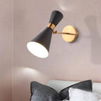 The Black Chrome LED Wall Light casts a soft, warm indoor glow on the wall.