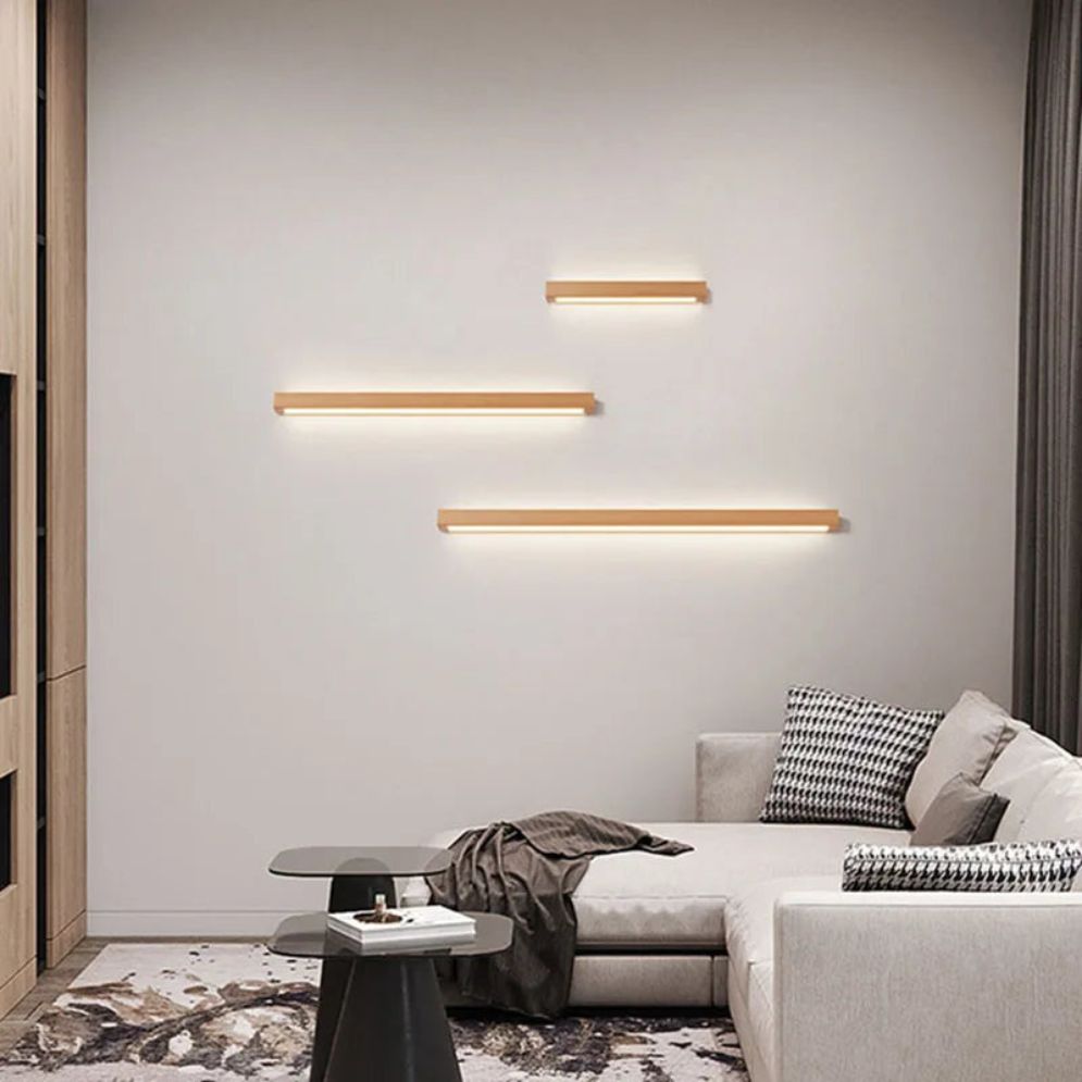 Three ORLUNE HOME adjustable LED wooden wall lights bring modern warmth to white walls.