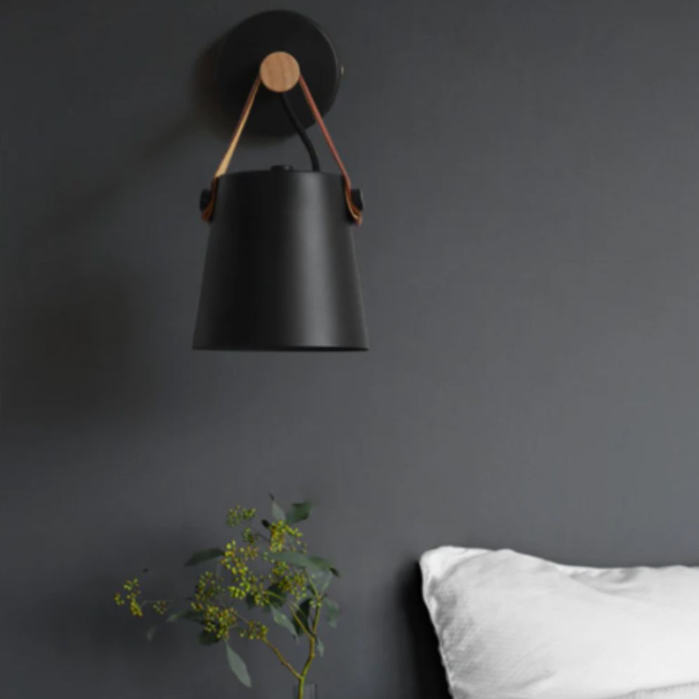 The sconce provides elegant, adjustable lighting with a Nordic modern wood and metal design.