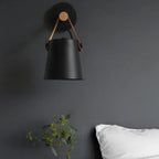 The sconce provides elegant, adjustable lighting with a Nordic modern wood and metal design.