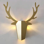 Warm LED backlighting forms a soft halo around a geometric deer head for kids' spaces.