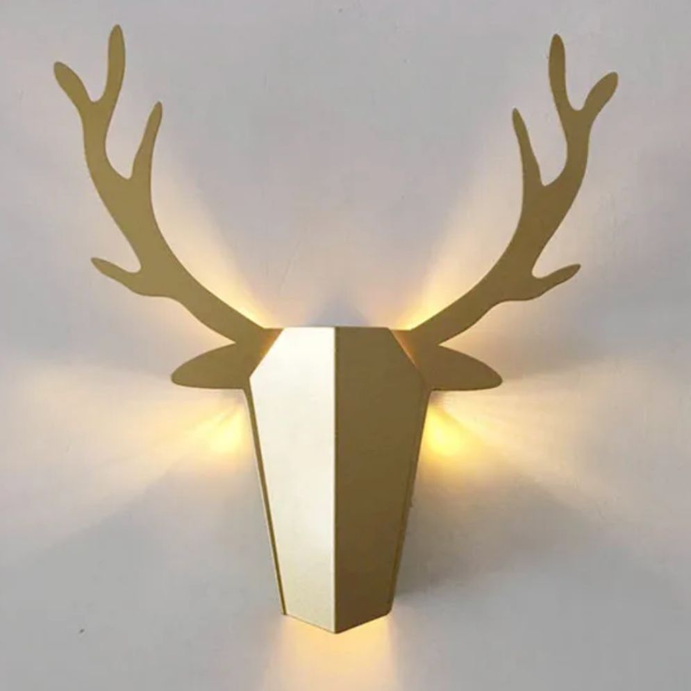 Warm LED backlighting forms a soft halo around a geometric deer head for kids' spaces.