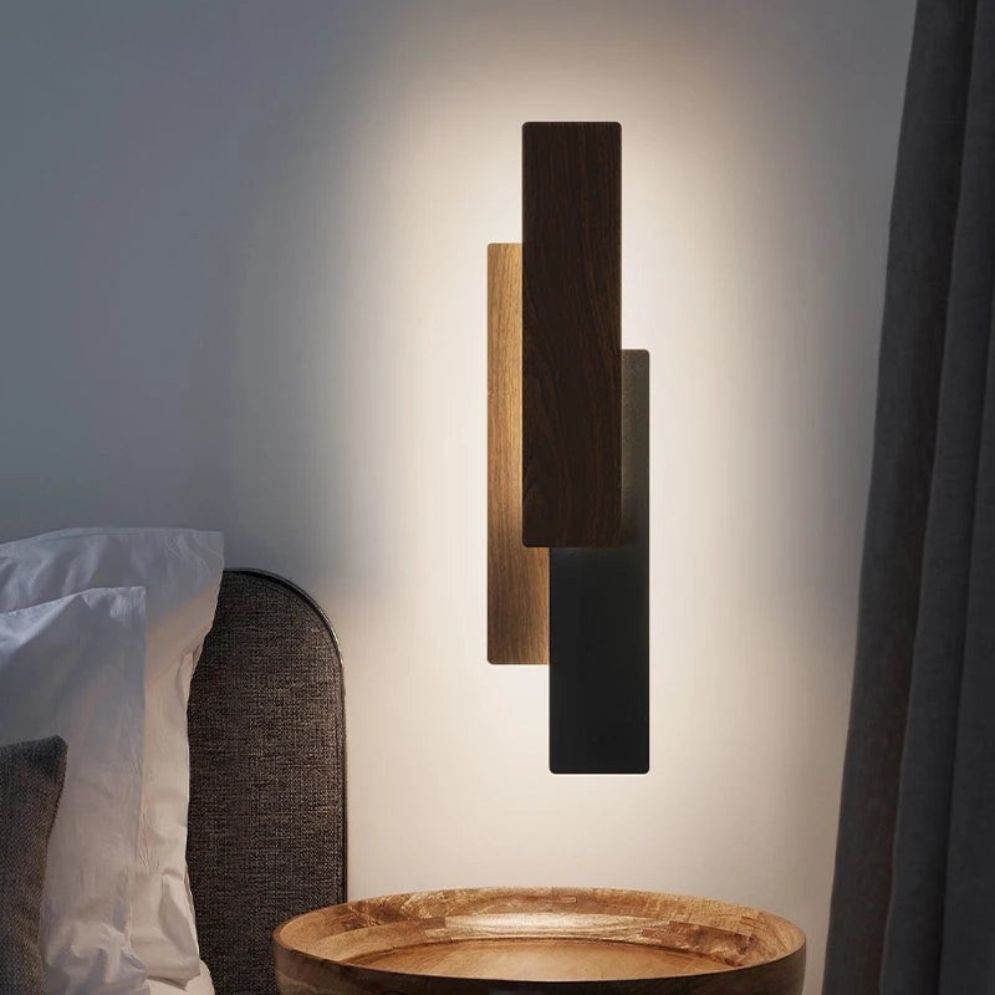 The ORLUNE HOME LED Wall Light casts a soft, modern glow through layered wooden panels.
