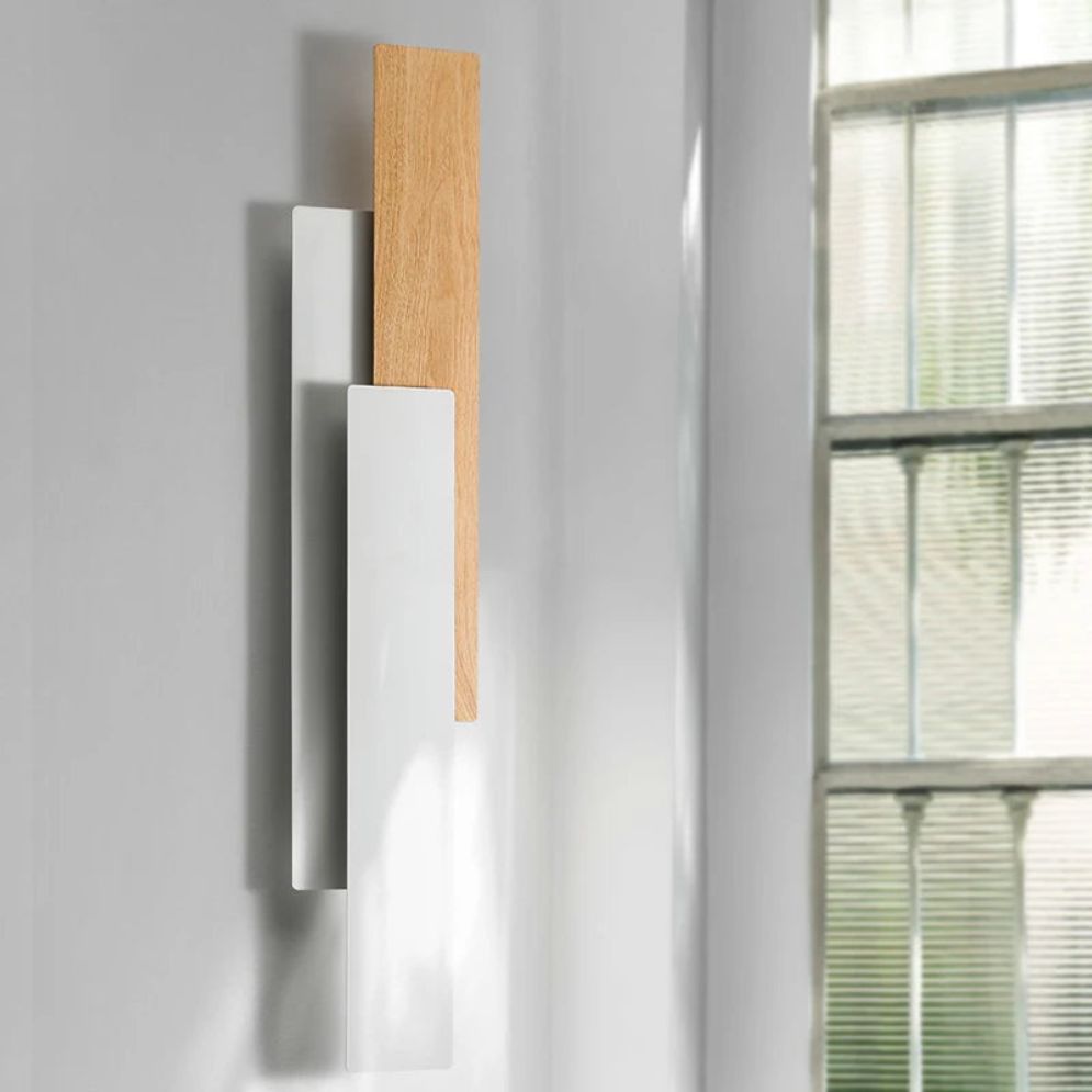 Natural wood LED wall light casts warm, stylish illumination in your room.