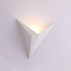 Soft, warm LED light elegantly glows upward, enhancing your wall with a modern touch.