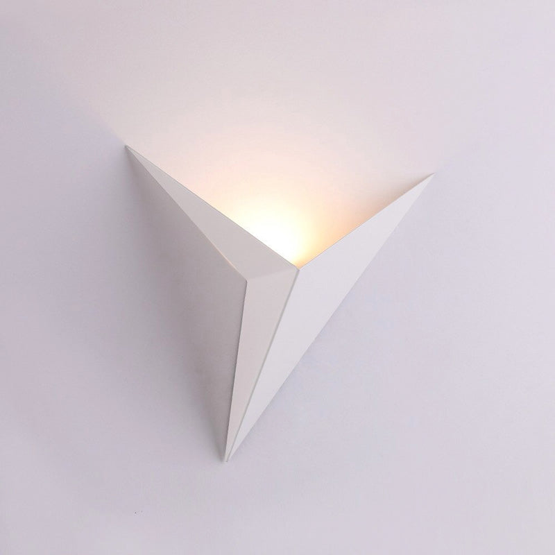 Soft, warm LED light elegantly glows upward, enhancing your wall with a modern touch.