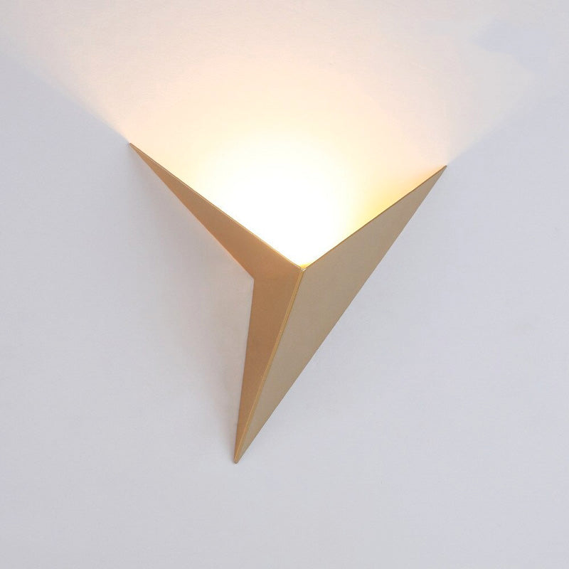 Warm LED upward lighting creates a soft, inviting glow with a modern geometric touch.