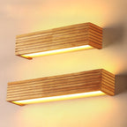 Warm yellow LED glow and sleek grooves create inviting, modern bathroom lighting.