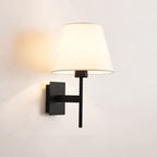 Warm accent lighting radiates from a white fabric shade for a cozy ambiance.