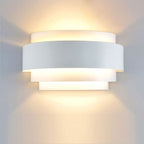 Soft, up-and-down LED lighting from overlapping bands creates an elegant wall effect.