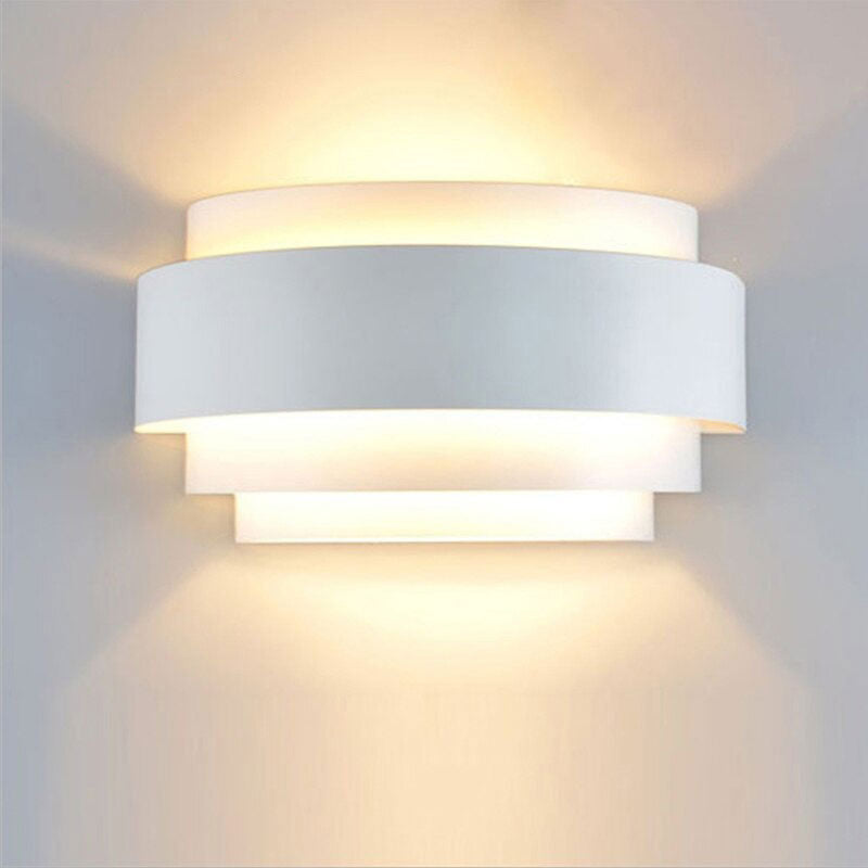 Soft, up-and-down LED lighting from overlapping bands creates an elegant wall effect.