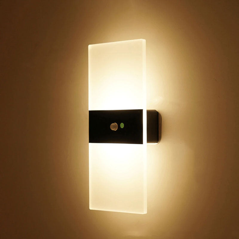 Warm LED glow radiates through frosted panel, softly illuminating walls with modern elegance.