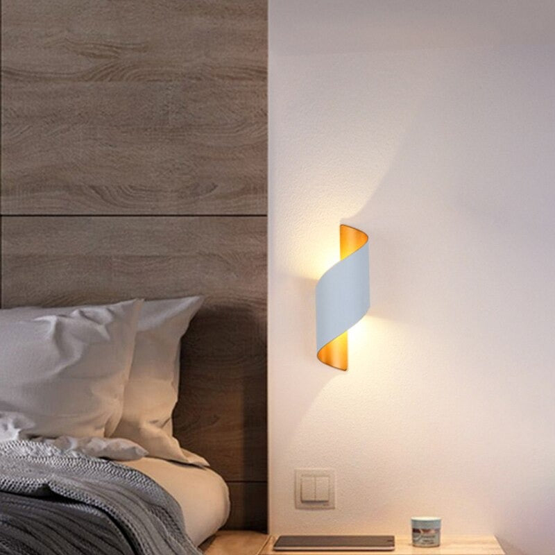 The Modern Spiral LED Wall Sconce casts a warm, inviting glow—perfect for any setting.