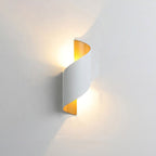 This LED spiral wall light emits warm up and down lighting, creating a soft, inviting glow.