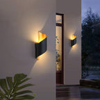 Warm LED spiral wall lights cast a cozy, inviting glow in the dim evening.