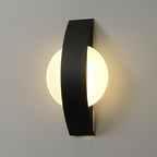 Glowing circular wall light radiates modern elegance, creating stunning illumination with sleek design.