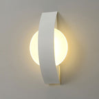 Elegant ring wall light emits a soft, modern glow through a curved acrylic panel.